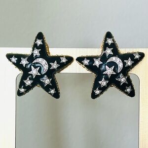 Quacker Factory black enamel with clear crystals moon & stars clip earrings